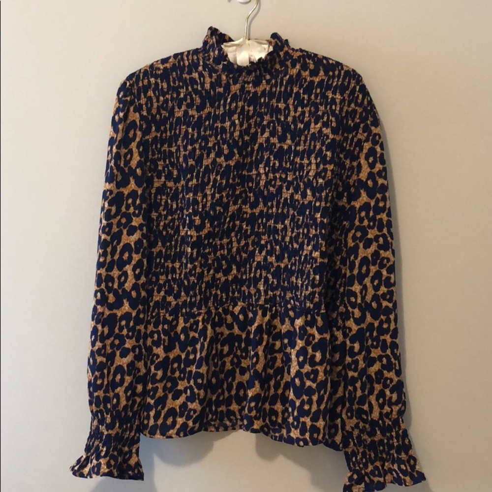 Leopard peplum top with mock neck
